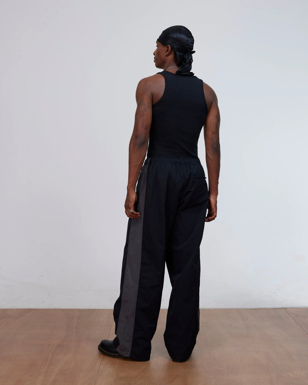 Patta Panelled Oversized Track Pants (Black) Patta